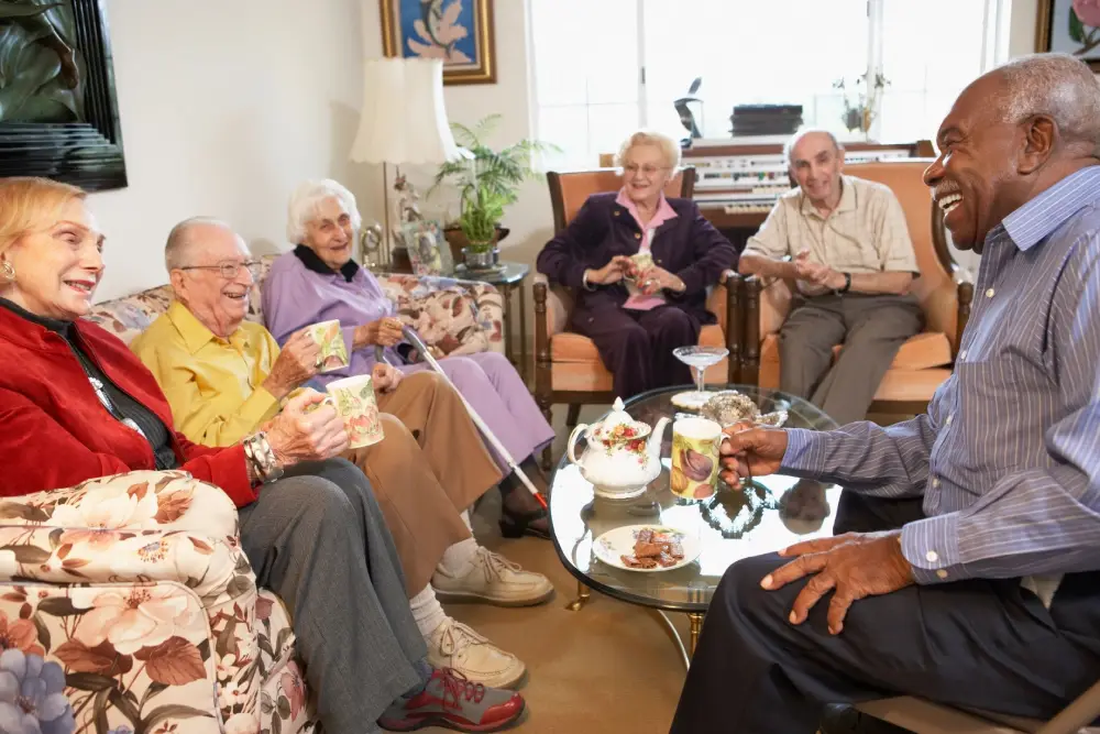 A group of people sitting around in chairs.